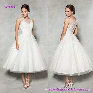 Vintage Style Tea-Length Wedding Dress with Lace Embellished Illusion Neckline Gives This Classic A-Line a Modern Update